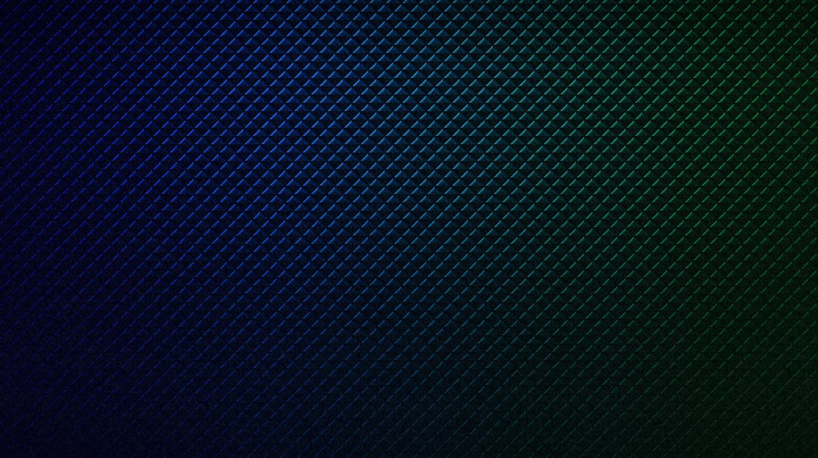 Abstract textural pattern of triangles and edges in blue and green